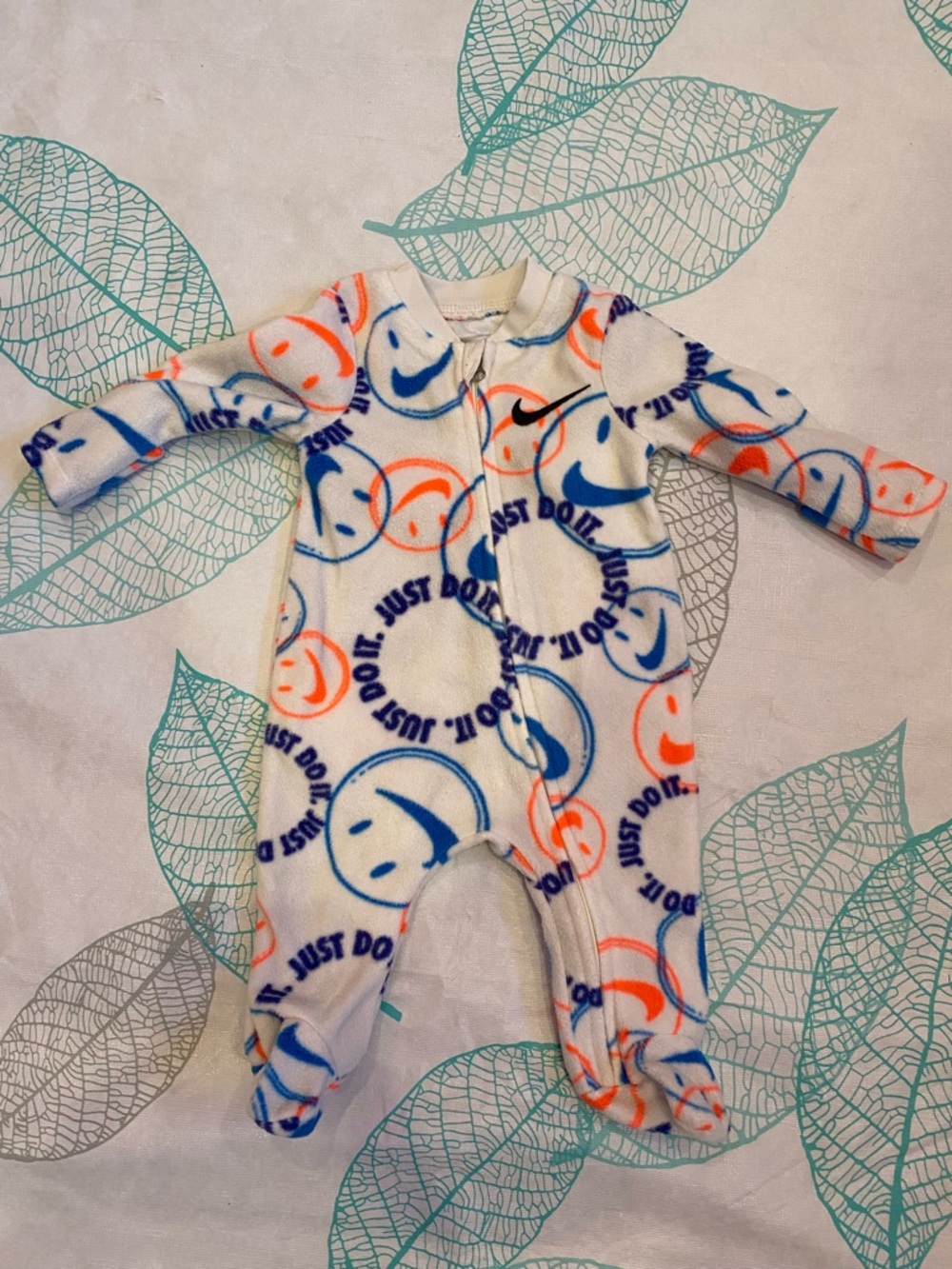 Nike White Fleece Baby Footed One-Piece with Blue & Orange Smiley Print